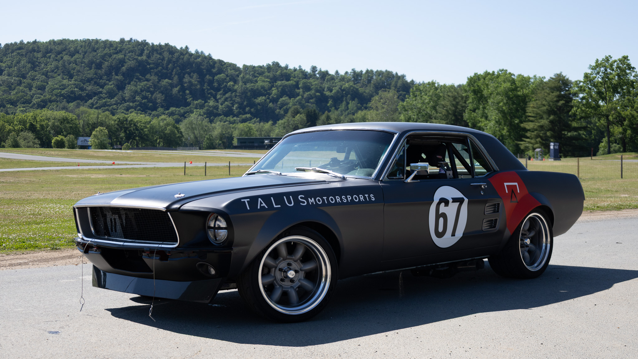 1967 Mustang Coupe at Lime Rock Park, side three-quarter view